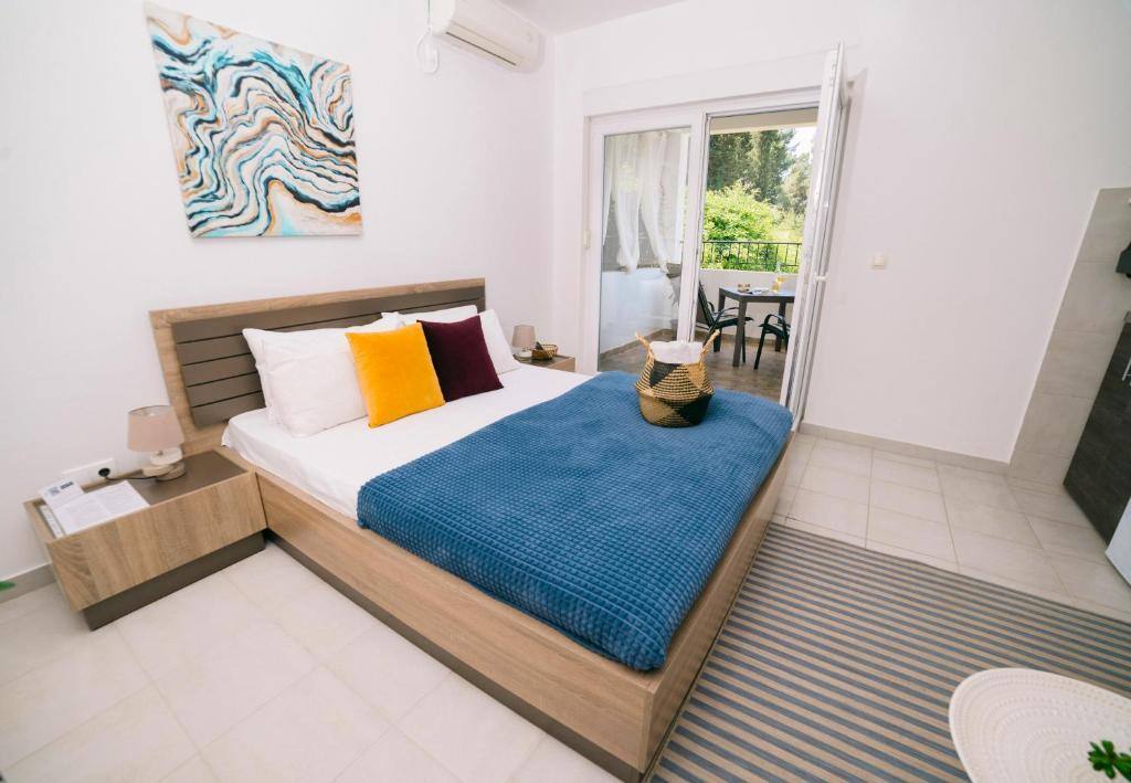 Modern bedroom with wooden bed frame and terrace doors
